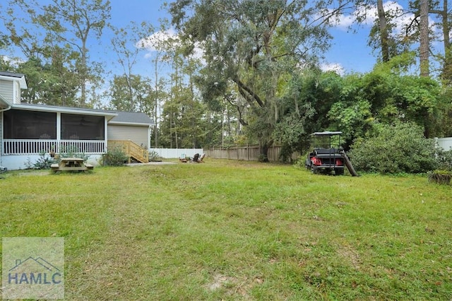 view of yard featuring a sunroom