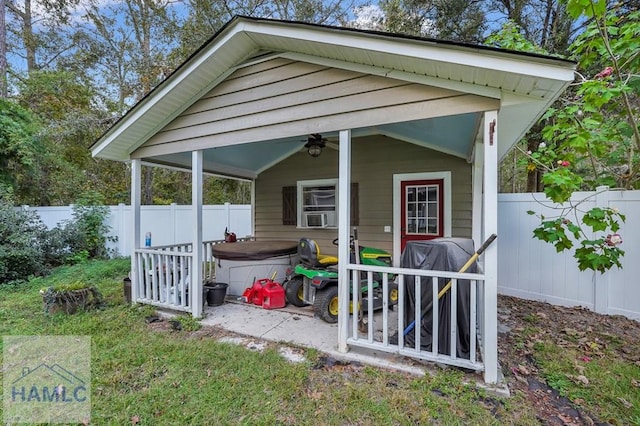 view of outbuilding featuring cooling unit and a hot tub