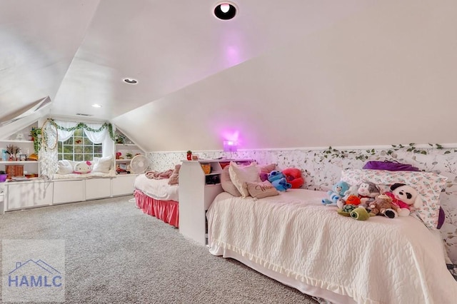 carpeted bedroom with lofted ceiling