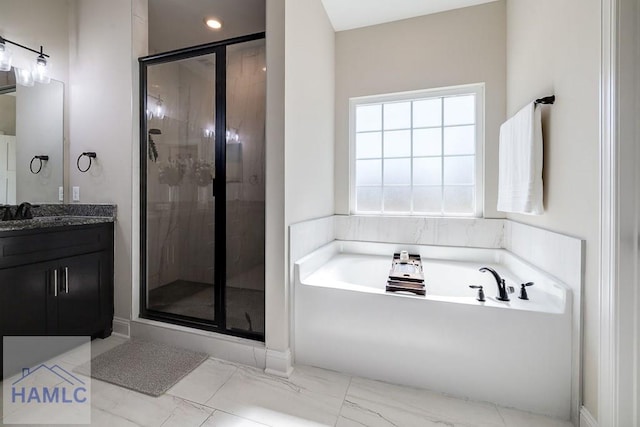 bathroom with a stall shower, marble finish floor, a bath, and vanity