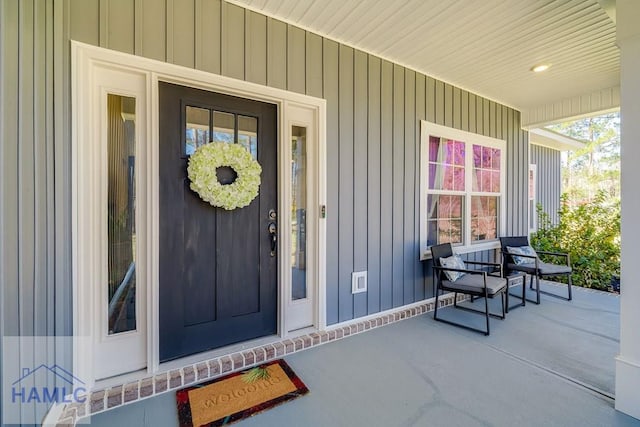 view of exterior entry with covered porch