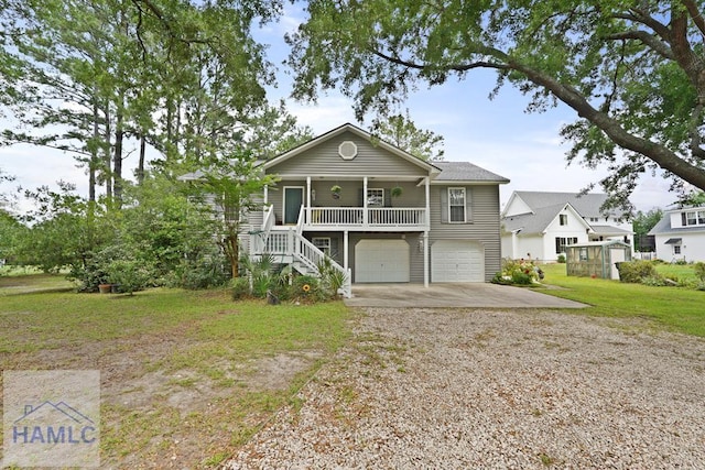 132 River Rd, Midway, GA 31320 - view of front facade with driveway, stairs, covered porch, a garage, and a front yard