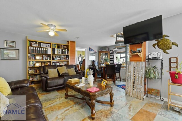 132 River Rd, Midway, GA 31320 - living area featuring a ceiling fan and stone finish flooring