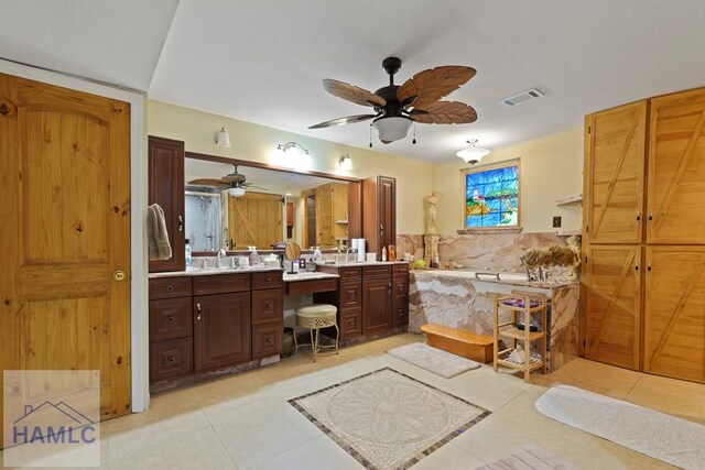 132 River Rd, Midway, GA 31320 - bathroom with tile patterned flooring, vanity, ceiling fan, and a bath