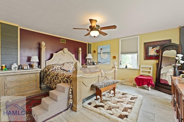 132 River Rd, Midway, GA 31320 - bedroom featuring wood finished floors and a ceiling fan
