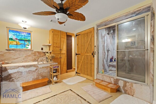 132 River Rd, Midway, GA 31320 - full bathroom with a bath, a marble finish shower, a ceiling fan, and tile patterned flooring