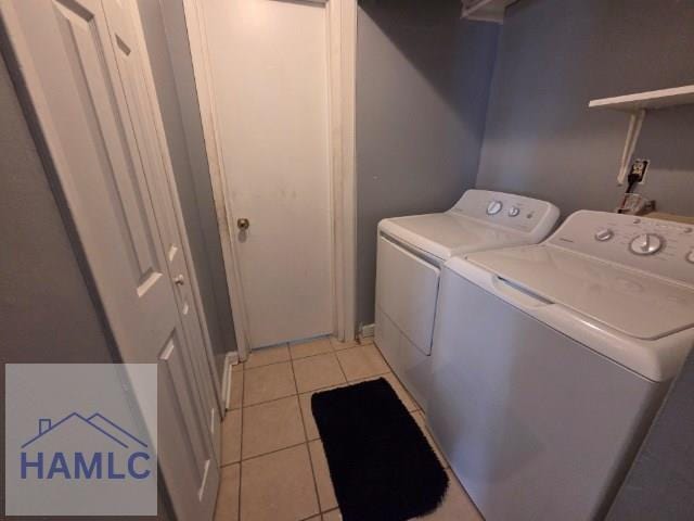 158 Sequoia Cir, Hinesville, GA 31313 - washroom featuring washing machine and dryer and light tile patterned floors