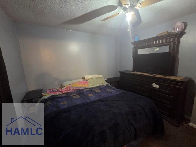 158 Sequoia Cir, Hinesville, GA 31313 - bedroom featuring ceiling fan, a textured ceiling, and carpet flooring