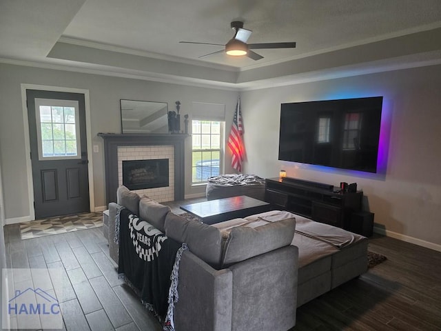 1942 Salisbury Way, Hinesville, GA 31313 - living room featuring a raised ceiling, wood finished floors, plenty of natural light, and crown molding