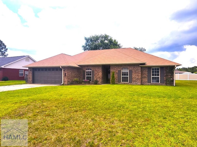 1942 Salisbury Way, Hinesville, GA 31313 - ranch-style house with a garage, concrete driveway, brick siding, and a shingled roof