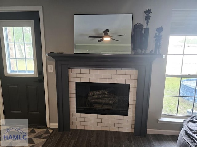 1942 Salisbury Way, Hinesville, GA 31313 - detailed view of baseboards, ceiling fan, a tiled fireplace, and wood finished floors