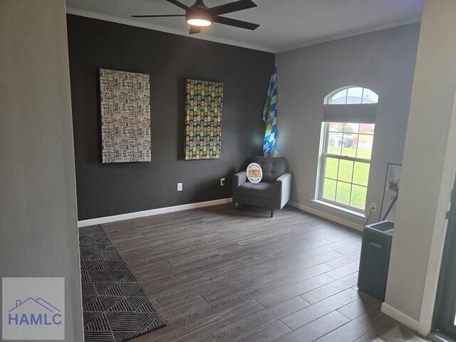 1942 Salisbury Way, Hinesville, GA 31313 - living area with wood finished floors, healthy amount of natural light, a ceiling fan, crown molding, and baseboards