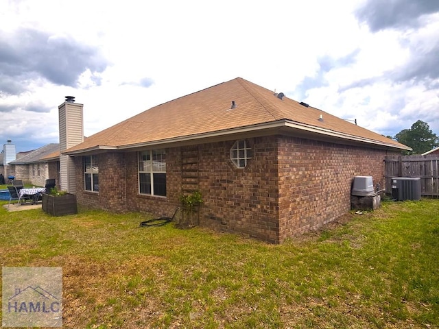 1942 Salisbury Way, Hinesville, GA 31313 - view of property exterior with central AC and brick siding