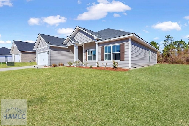 view of front of house with a garage and a front lawn