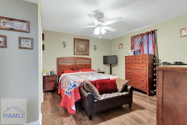 bedroom featuring hardwood / wood-style floors and ceiling fan