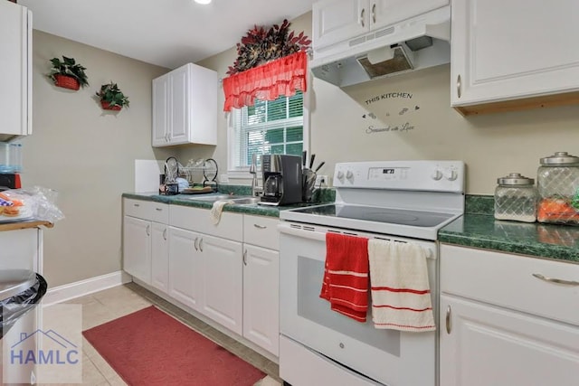 kitchen featuring sink, white cabinets, light tile patterned flooring, and white electric stove