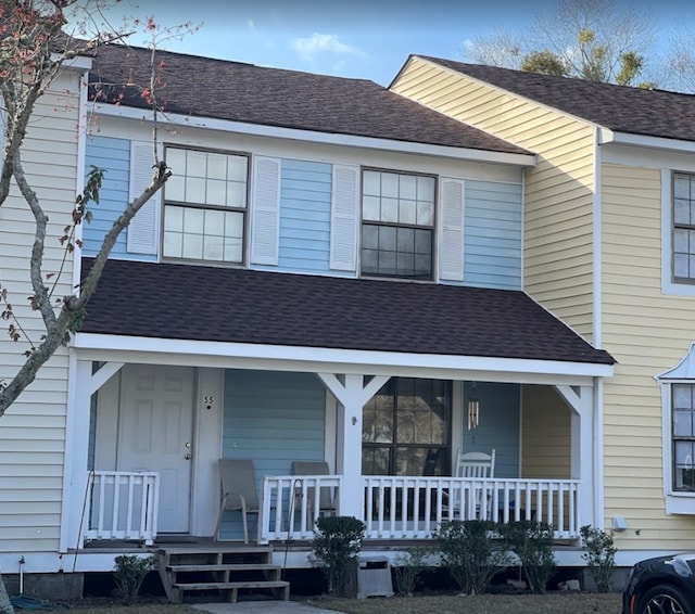 view of front of property featuring cooling unit and a porch