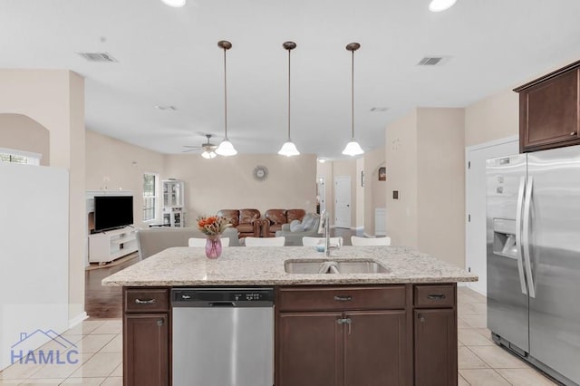 23 Veranda Trl, Midway, GA 31320 - kitchen featuring appliances with stainless steel finishes, light tile patterned floors, dark brown cabinets, and a ceiling fan