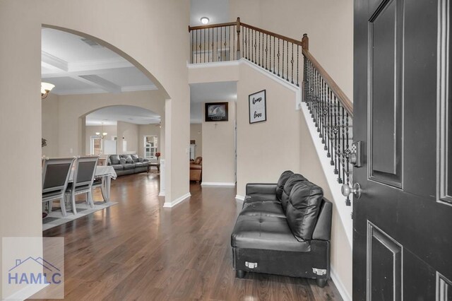23 Veranda Trl, Midway, GA 31320 - foyer entrance with wood finished floors, arched walkways, ornamental molding, beam ceiling, and coffered ceiling
