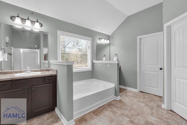 23 Veranda Trl, Midway, GA 31320 - bathroom with a shower stall, lofted ceiling, a bath, and vanity