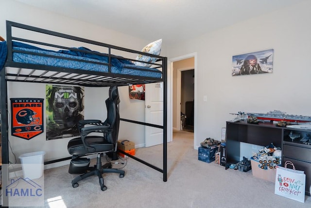 carpeted bedroom featuring baseboards