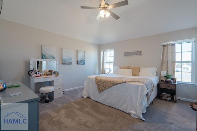 carpeted bedroom with lofted ceiling, baseboards, and a ceiling fan