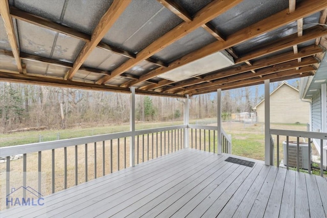 wooden terrace featuring central AC and a lawn