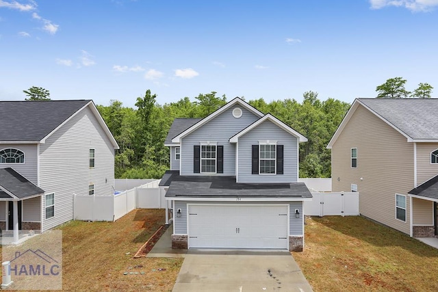 view of front of home featuring a front yard and a garage