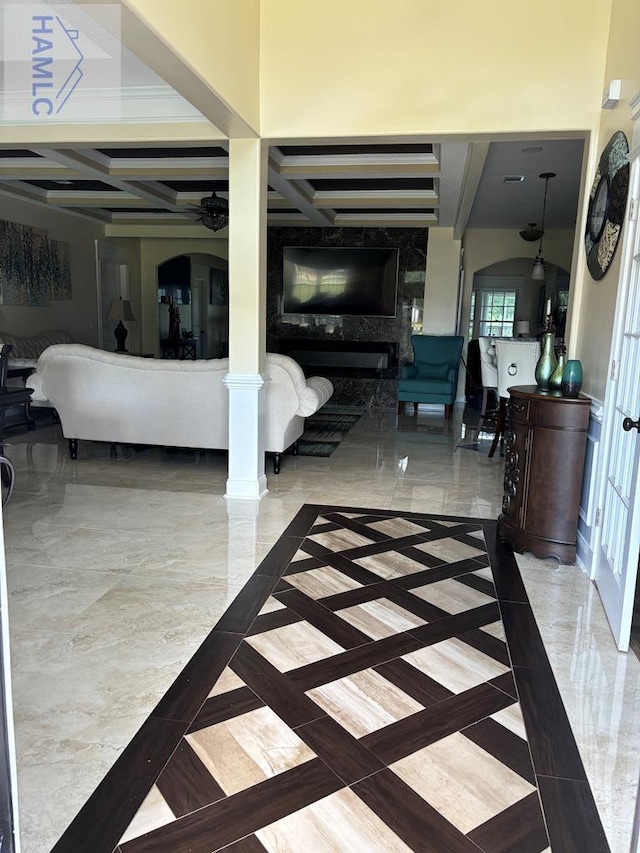 interior space with beamed ceiling and coffered ceiling