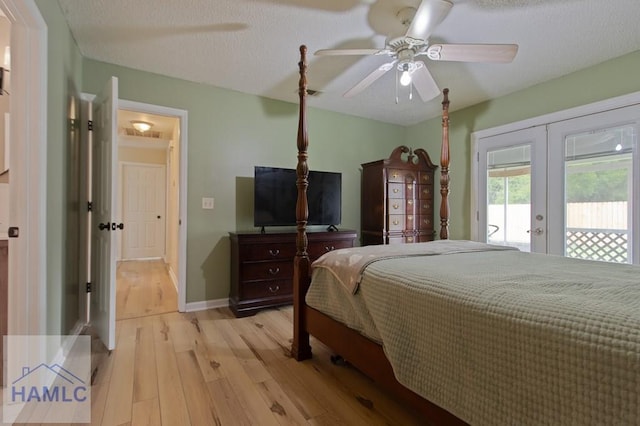 1453 Fritts Ct, Hinesville, GA 31313 - bedroom featuring french doors, access to outside, light wood-style flooring, a ceiling fan, and baseboards