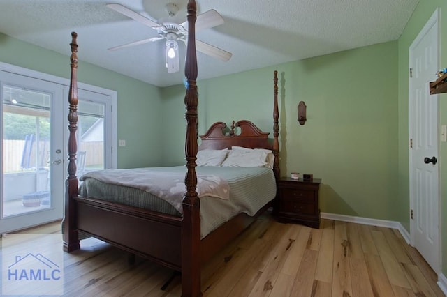 1453 Fritts Ct, Hinesville, GA 31313 - bedroom featuring access to outside, light wood finished floors, a ceiling fan, baseboards, and a textured ceiling
