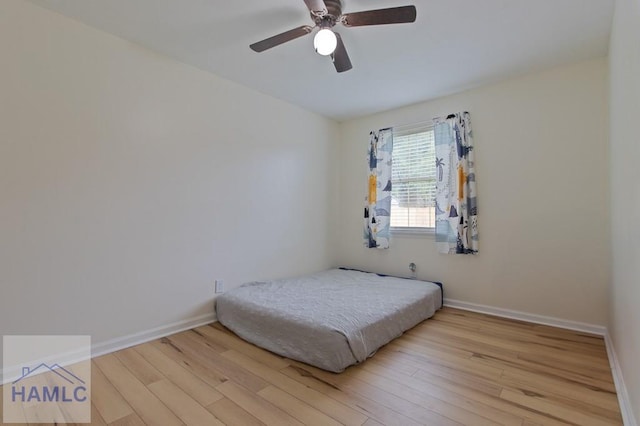 1453 Fritts Ct, Hinesville, GA 31313 - bedroom with wood finished floors, baseboards, and a ceiling fan