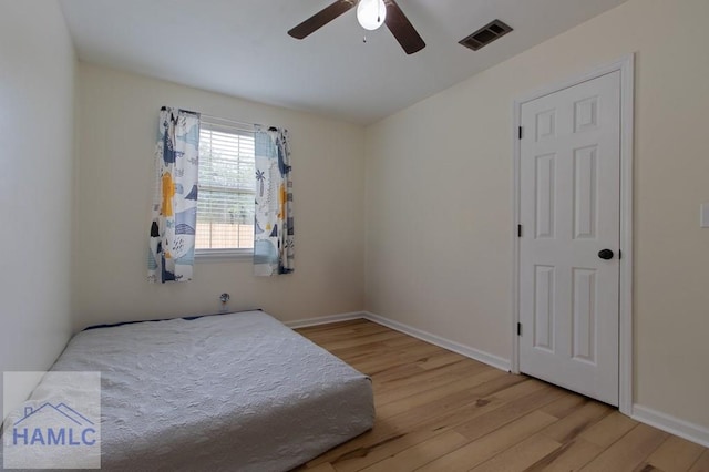 1453 Fritts Ct, Hinesville, GA 31313 - bedroom featuring wood finished floors, ceiling fan, and baseboards