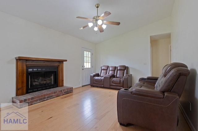 1453 Fritts Ct, Hinesville, GA 31313 - living room with vaulted ceiling, ceiling fan, light wood-style floors, and a fireplace