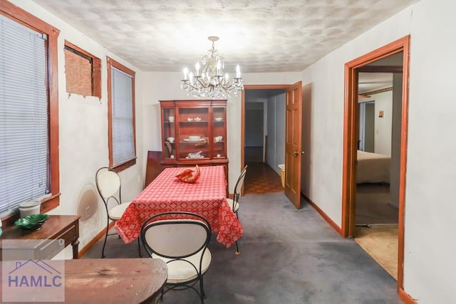 707 Church St, Claxton, GA 30417 - dining area with an inviting chandelier, baseboards, and carpet