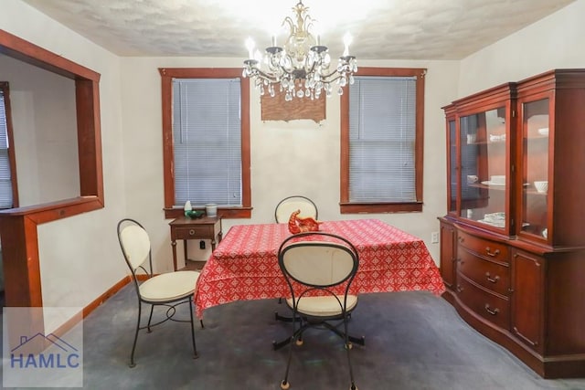 707 Church St, Claxton, GA 30417 - dining room featuring baseboards, an inviting chandelier, and carpet