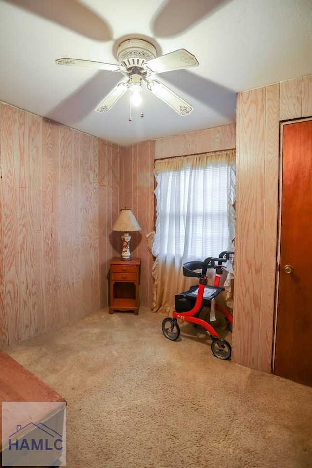 707 Church St, Claxton, GA 30417 - misc room featuring wooden walls, carpet, and a ceiling fan