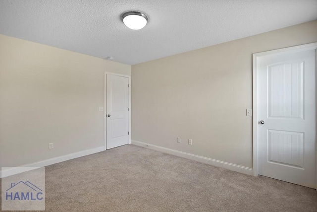 702 Fairview Cir, Hinesville, GA 31313 - unfurnished room featuring a textured ceiling and carpet floors