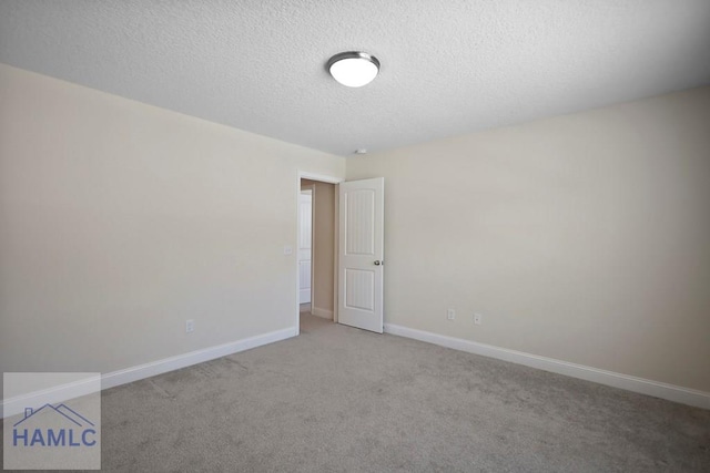 702 Fairview Cir, Hinesville, GA 31313 - spare room featuring a textured ceiling and carpet floors
