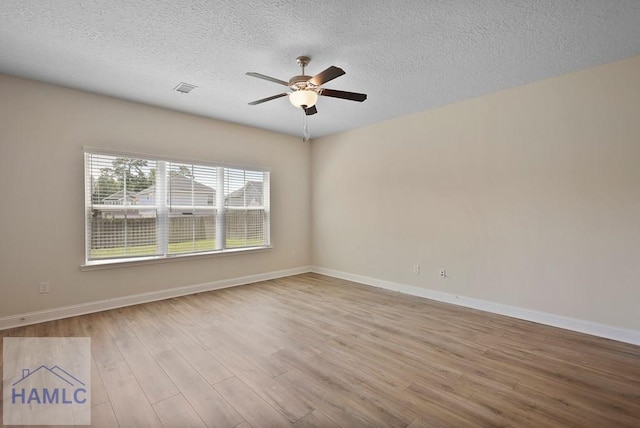 702 Fairview Cir, Hinesville, GA 31313 - unfurnished room featuring ceiling fan, wood finished floors, and a textured ceiling
