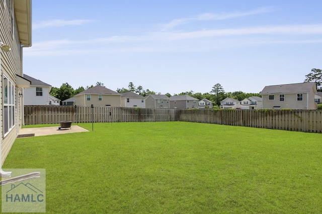 702 Fairview Cir, Hinesville, GA 31313 - fenced backyard with a residential view and a patio