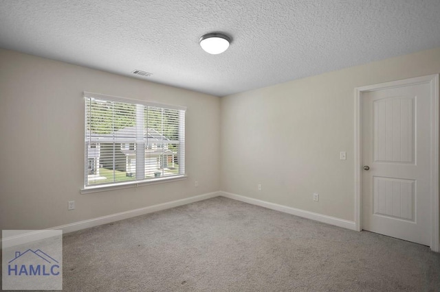 702 Fairview Cir, Hinesville, GA 31313 - unfurnished room featuring a textured ceiling and carpet floors