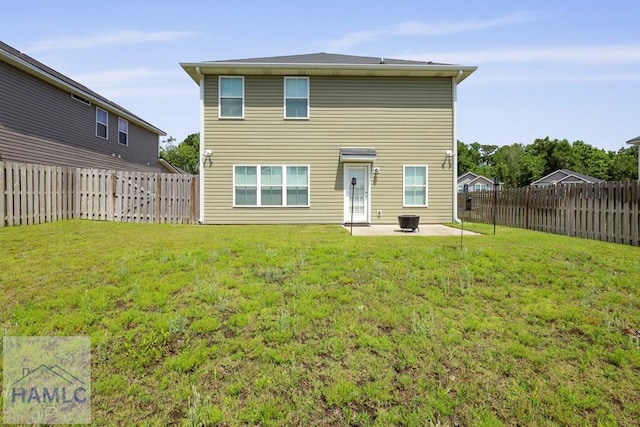 702 Fairview Cir, Hinesville, GA 31313 - rear view of house featuring a patio area and a fenced backyard