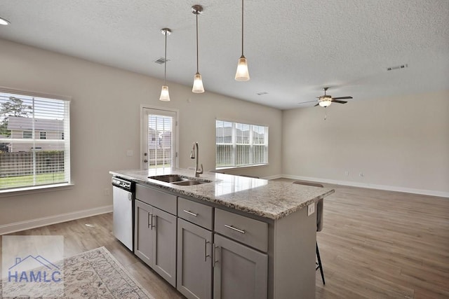 702 Fairview Cir, Hinesville, GA 31313 - kitchen featuring dishwasher, gray cabinetry, a textured ceiling, ceiling fan, and light wood-style flooring