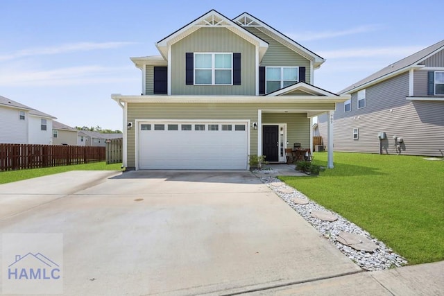 702 Fairview Cir, Hinesville, GA 31313 - view of front of home featuring an attached garage, concrete driveway, board and batten siding, and covered porch