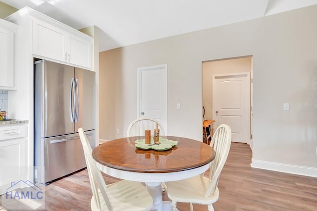 dining room with light wood-type flooring