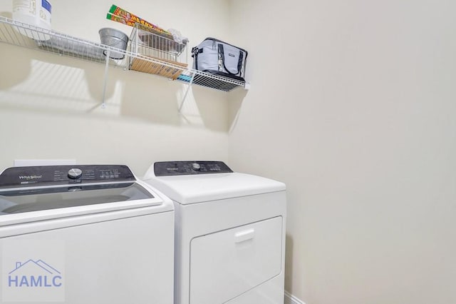 laundry room with washing machine and clothes dryer