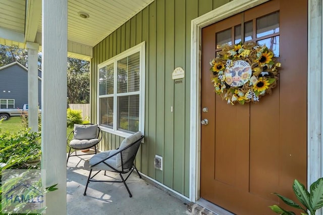 entrance to property featuring covered porch