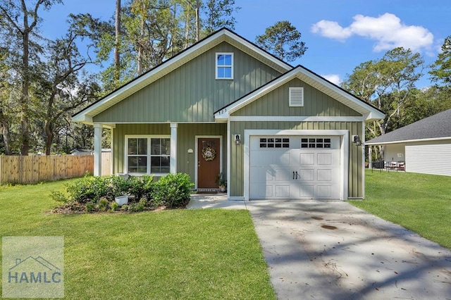 view of front facade with a front yard and a garage