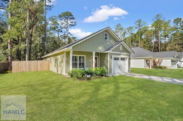 view of front of property with a front lawn and a garage